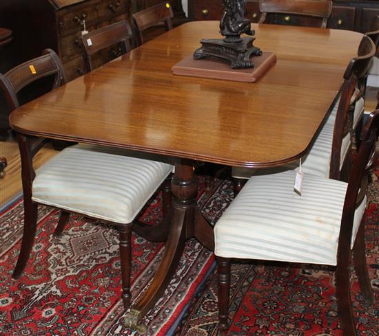 A Regency design mahogany twin pillar extending dining table W.190cm extended (one spare leaf)